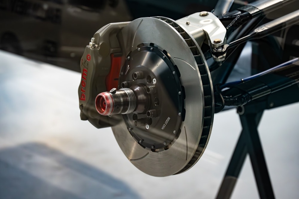 Close-up of a slotted brake rotor and caliper